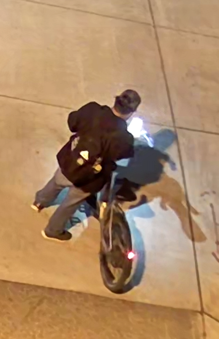 White male suspect with black backpack and white ebike 