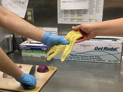 Handing someone a cut glove