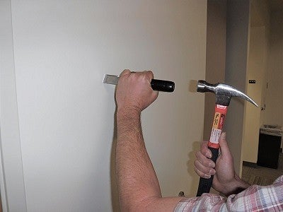 Hammering into a wall