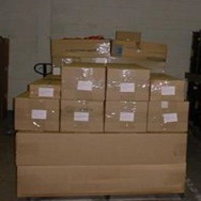 Boxes neatly stacked, sealed shut, with labels taped on the sides.