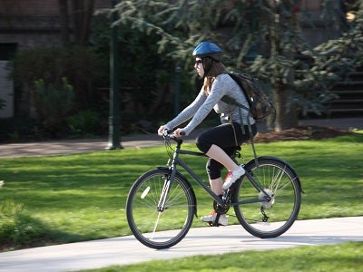 Riding bicycle with helmet