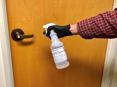 Sanitizing doorknob with saltwater biocide sanitizer